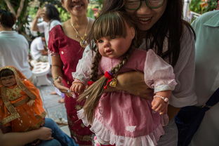 泰国流行收养 神仙娃娃 和养真孩子无异 