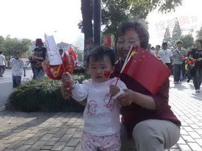 圣火杭州传递 小朋友手拿国旗欢迎圣火 